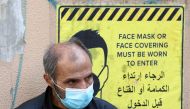 A man wearing a protective face mask waits to get tested for the coronavirus disease (COVID-19), in Beirut, Lebanon January 4, 2021. Picture taken January 4, 2021. REUTERS/Mohamed Azakir
