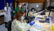 Pharmacy technician supervisor Tamara Booth Rumsey prepares a Pfizer-BioNTech coronavirus disease (COVID-19) vaccine at The Michener Institute, in Toronto, Canada January 4, 2021. REUTERS/Carlos Osorio
