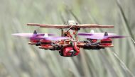 A drone, partially made with pineapple stems, flies at a pineapple plantation in Jenjarom, Malaysia December 12, 2020. Picture taken December 12, 2020. REUTERS/Lim Huey Teng