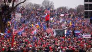 Supporters of U.S. President Donald Trump gather near the Washington Monument by the White House ahead of his rally and speech to contest the certification by the U.S. Congress of the results of the 2020 U.S. presidential election in Washington, U.S, Janu
