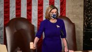 U.S. House Speaker Nancy Pelosi (D-CA) wears a protective mask while banging the Speaker's gavel during a joint session of Congress to count the Electoral College votes of the 2020 presidential election in the House Chamber in Washington, U.S., January 6,