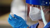 FILE PHOTO: A nurse prepares a syringe with the COVID-19 vaccine for a worker of the New York City Fire Department Bureau of Emergency Medical Services (FDNY EMS), amid the coronavirus disease (COVID-19) pandemic in the Manhattan borough of New York City,