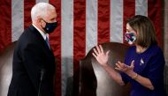 Speaker of the House Nancy Pelosi (D-CA) and Vice President Mike Pence talk before a joint session to certify the 2020 election results, at the Capitol in Washington, U.S., January 6, 2021. J. Scott Applewhite/Pool via REUTERS
