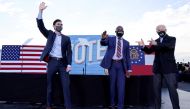 FILE PHOTO: President-elect Joe Biden points to Democratic Senate candidates from Georgia Jon Ossoff  and Raphael Warnock, as he campaigns on their behalf ahead of their January 5 run-off elections, during a drive-in campaign rally in Atlanta, Georgia, Ja