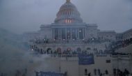Police officers stand guard as supporters of US President Donald Trump gather in front of the US Capitol Building in Washington, US, January 6, 2021. Reuters/Leah Millis