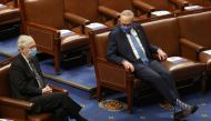 Senate Majority Leader Mitch McConnell (L) and Senate Democratic Leader Chuck Schumer are seen during a joint session of Congress after they reconvened to certify the Electoral College votes of the 2020 presidential election in the House chamber in Washin