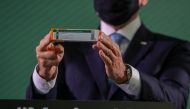 Brazil's Sao Paulo state governor Joao Doria holds a box of China's Sinovac coronavirus disease (COVID-19) vaccine during a news conference about its efficacy results at Instituto Butantan in Sao Paulo, Brazil January 7, 2021. REUTERS/Amanda Perobelli