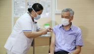 Singapore's Prime Minister Lee Hsien Loong receives his coronavirus disease (COVID-19) vaccination jab at Singapore General Hospital January 8, 2021. Mohd Fyrol/Ministry of Communications and Information/Handout via REUTERS.