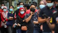 People wait in line to be tested for the coronavirus disease (COVID-19) in Shah Alam, Malaysia January 7, 2021. REUTERS/Lim Huey Teng