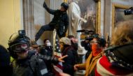 FILE PHOTO: Pro-Trump protesters storm the Capitol Building, January 6. REUTERS/Ahmed Gaber