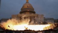 An explosion caused by a police munition is seen while supporters of US President Donald Trump gather in front of the US Capitol Building in Washington, US, January 6, 2021. Reuters/Leah Millis
