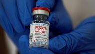FILE PHOTO: An employee shows the Moderna coronavirus disease (COVID-19) vaccine at Northwell Health's Long Island Jewish Valley Stream hospital in New York, U.S., December 21, 2020. REUTERS/Eduardo Munoz/File Photo
