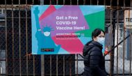 A woman arrives to line up to receive a dose of the coronavirus disease (COVID-19) vaccine at a 24 hour vaccination center at the Brooklyn Army Terminal in Brooklyn, New York, U.S., January 11, 2021. REUTERS/Brendan McDermid
