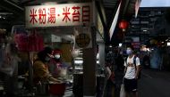 A customer wearing a protective mask, amid the coronavirus disease pandemic, waits for his order at a market in Taipei, Taiwan, January 6, 2021. Reuters/Ann Wang/File Photo