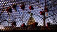 Roses are placed in a security fence at the U.S. capitol as Democratic members of the House prepare an article of impeachment against U.S. President Donald Trump in Washington, U.S., January 12, 2021. REUTERS/Joshua Roberts
