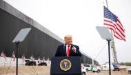 U.S. President Donald Trump gestures as he speaks during a visit at the U.S.-Mexico border wall, in Alamo, Texas, U.S., January 12, 2021. REUTERS/Carlos Barria
