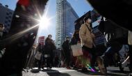 Passersby wearing protective face masks walks at Shibuya crossing after the government declared the second state of emergency for the capital and some prefectures, amid coronavirus disease (COVID-19) outbreak, in Tokyo, Japan January 9, 2021. REUTERS/Isse
