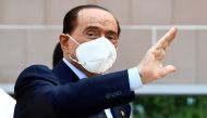 Former Italian Prime Minister Silvio Berlusconi gestures as he is discharged from Milan's San Raffaele hospital, where he was being treated after testing positive for the coronavirus disease (COVID-19) and diagnosed with mild pneumonia, in Milan, Italy, S