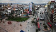 People and Transmilenio system buses are seen in the commercial area of San Victorino during the mandatory total isolation decreed by the mayor's office, amidst an outbreak of the coronavirus disease (COVID-19), in Bogota, Colombia January 8, 2021. REUTER