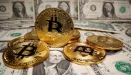 FILE PHOTO: Representations of virtual currency bitcoin are placed on U.S. Dollar banknotes in this illustration taken May 26, 2020. REUTERS/Dado Ruvic/Illustration/File Photo
