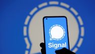 The Signal messaging app logo is seen on a smartphone, in front of the same displayed same logo, in this illustration taken, January 13, 2021. REUTERS/Dado Ruvic