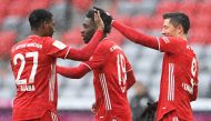 Soccer Football - Bundesliga - Bayern Munich v SC Freiburg - Allianz Arena, Munich, Germany - January 17, 2021 Bayern Munich's Robert Lewandowski celebrates scoring their first goal with Alphonso Davies and David Alaba Pool via REUTERS/Christof Stache DFL