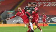 Soccer Football - Premier League - Liverpool v Manchester United - Anfield, Liverpool, Britain - January 17, 2021 Manchester United's Anthony Martial in action with Liverpool's Fabinho and Georginio Wijnaldum Pool via REUTERS/Paul Ellis 