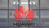 FILE PHOTO: Huawei logo is pictured on the headquarters building in Reading, Britain July 14, 2020. REUTERS/Matthew Childs/File Photo
