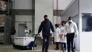 A man carries boxes containing a batch of Sinovac's coronavirus disease (COVID-19) vaccine to be distributed in Campinas as the vaccination starts in Sao Paulo, Brazil January 18, 2021. REUTERS/Amanda Perobelli