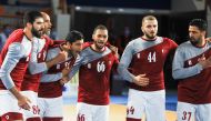 Qatar players celebrtae after defeating Japan on Sunday.