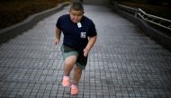 Kyuta Kumagai, 10, runs up stairs while training at Track Tokyo Running Club in Tokyo, Japan, August 21, 2020. Reuters/Kim Kyung-Hoon 
