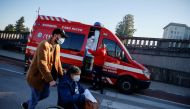 FILE PHOTO: An ambulance carrying a COVID-19 patient is seen outside Santa Maria Hospital, during the coronavirus disease (COVID-19) pandemic in Lisbon, Portugal, January 18, 2021. REUTERS/Pedro Nunes/File Photo
