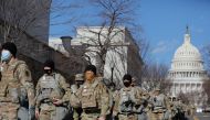 Members of the National Guard patrol near the U.S. Capitol building ahead of U.S. President-elect Joe Biden's inauguration, in Washington, U.S., January 19, 2021. REUTERS/Andrew Kelly
