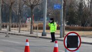 Police guard a blocked-off street in a residential neighbourhood following new cases of the coronavirus disease (COVID-19) in Tiangongyuan area of Daxing district in Beijing, China, January 20, 2021. REUTERS/Thomas Peter