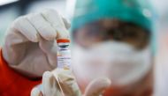FILE PHOTO: A medical worker holds a dose of the Sinovac's vaccine at a district health facility as Indonesia begins mass vaccination for the coronavirus disease (COVID-19), starting with its healthcare workers, in Jakarta, Indonesia January 14, 2021. REU