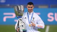 Juventus' Cristiano Ronaldo celebrates with the Italian Super Cup REUTERS/Alberto Lingria