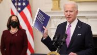 U.S. President Joe Biden speaks about his administration's plans to fight the coronavirus disease (COVID-19) pandemic during a COVID-19 response event as Vice President Kamala Harris listens at the White House in Washington, U.S., January 21, 2021. REUTER