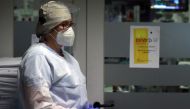 A member of the medical personnel wearing a protective suit, protective mask and face shield is seen in the intensive care unit at the CHIREC Braine l?Alleud-Waterloo hospital, in Braine l'Alleud, Belgium, October 23, 2020
