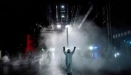 FILE PHOTO: Volunteers from the Blue Sky Rescue team disinfect at the Qintai Grand Theatre in Wuhan, Hubei province, the epicentre of China's coronavirus disease (COVID-19) outbreak, April 2, 2020. REUTERS/Aly Song/File Photo 