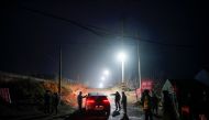 Security members keep watch at an entrance to the Hushan gold mine, where workers are trapped underground after the January 10 explosion, in Qixia, Shandong province, China January 21, 2021. Reuters/Aly Song