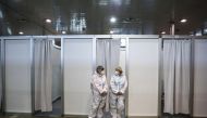 Medical workers take a brake from vaccinating Serbian Army officers with the Chinese Sinopharm vaccines as the country begins mass vaccination for the coronavirus disease (COVID-19), in Belgrade, Serbia, January 19, 2021. REUTERS/Marko Djurica
