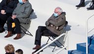 U.S. Senator Bernie Sanders sits socially distanced as he attends the Presidential Inauguration of Joe Biden on the West Front of the U.S. Capitol in Washington, U.S. January 20, 2021. Picture taken January 20, 2021. Caroline Brehman/Pool via REUTERS
