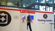 FILE PHOTO: A man opens the door of a testing center, as tighter rules for international travellers start, at Heathrow Airport, amid the spread of the coronavirus disease (COVID-19) pandemic, London, Britain, January 18, 2021. REUTERS/Henry Nicholls/File 