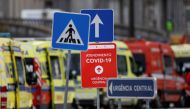 FILE PHOTO: Signs are seen as ambulances carrying patients with the coronavirus disease (COVID-19) queued outside the Santa Maria Hospital, as the coronavirus disease (COVID-19) outbreak continues, in Lisbon, Portugal, January 22, 2021. REUTERS/Pedro Nune