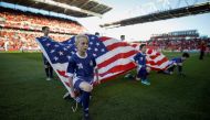 FILE PHOTO: Kids hold an American flag during the national anthems before Toronto FC play D.C. United in their MLS soccer match, at BMO Field, a venue for the 2026 FIFA World Cup, in Toronto, Ontario, Canada, June 13, 2018. REUTERS/Mark Blinch/File Photo