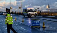 Garda (Irish Police) monitors the government-imposed 5km travel limit at a road checkpoint, amid the spread of the coronavirus disease (COVID-19), in Dublin, Ireland, January 24, 2021. Picture taken January 24, 2021. REUTERS/Clodagh Kilcoyne
