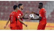 Michael Olunga (right) with team-mates after the end of Amir Cup match against Al Ahli on Monday. 
