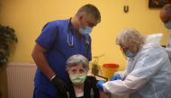 A woman receives a coronavirus disease (COVID-19) vaccine shot at a care home in Sofia, Bulgaria, January 27, 2021. Reuters/Stoyan Nenov