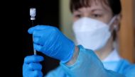 FILE PHOTO: A member of a mobile vaccination team prepares a shot of the coronavirus disease (COVID-19) vaccine at the Home of Holy Family, for people with mental disabilities of welfare organisation Caritas, in Prague, Czech Republic, January 13, 2021. R