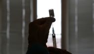 A healthcare worker fills a syringe with a dose of Sputnik V (Gam-COVID-Vac) vaccine against the coronavirus disease (COVID-19) at a hospital in the village of Donskoye in Stavropol Region, Russia January 27, 2021. REUTERS/Eduard Korniyenko
